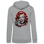 Grauer Damen-Hoodie, Rückansicht, mit einem Vintage-inspirierten Design. Das Motiv zeigt eine Frau mit roten Locken, die eine Kaffeetasse hält und zwinkert. Der Text lautet „None of my Business!“, gefolgt von „Your drama is really entertaining to someone else.“. Der Hoodie kombiniert eine schlichte Farbe mit einem humorvollen Retro-Statement auf der Rückseite.