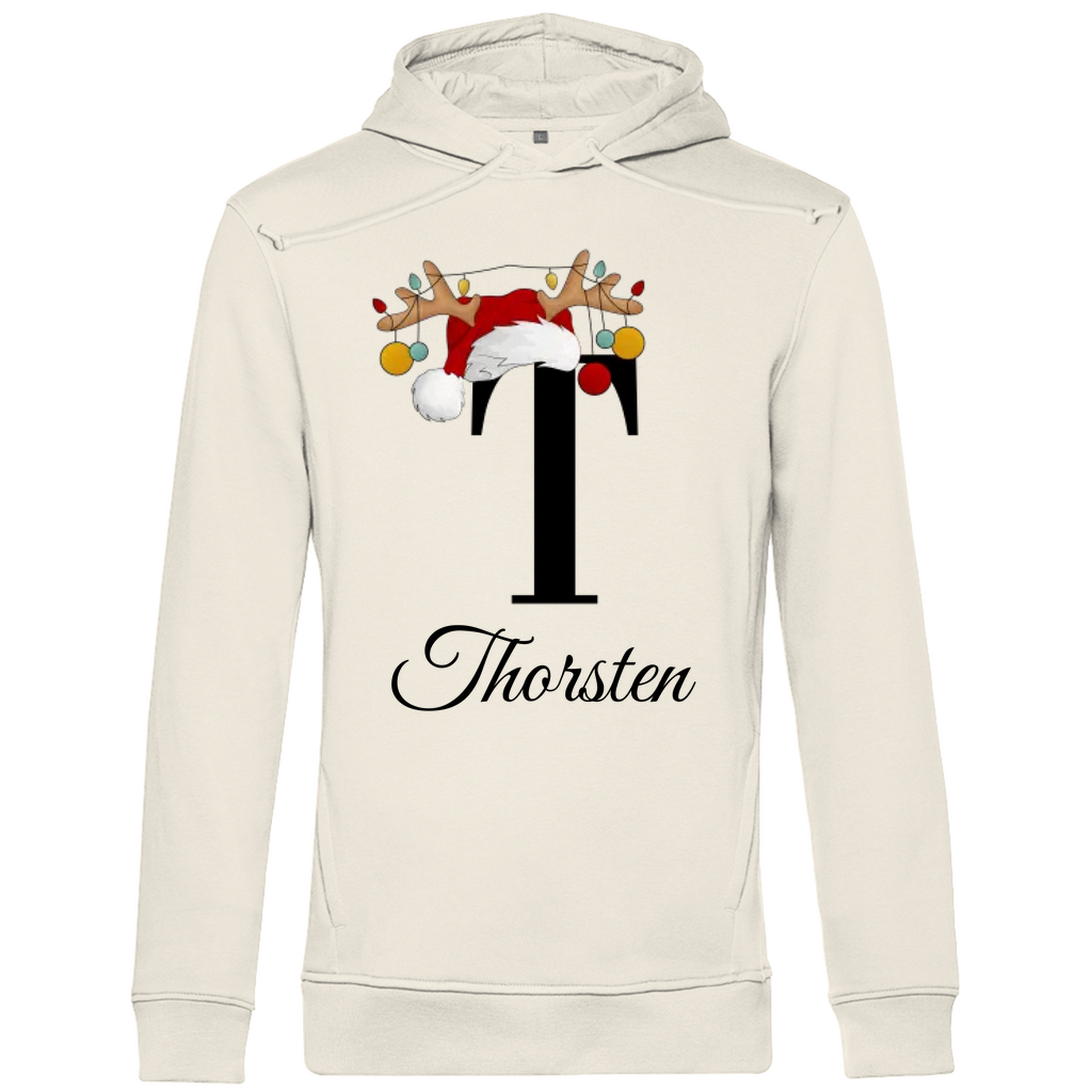 Ein cremefarbenen Hoodie mit einem weihnachtlichen Design, das den Buchstaben „T“ in Schwarz zeigt. Der Buchstabe ist mit einem Weihnachtsmann-Hut sowie Rentiergeweihen verziert, an denen bunte Kugeln hängen. Unter dem Buchstaben steht der Name „Thorsten“ in eleganter, geschwungener Schrift. Der Hoodie verleiht eine festliche und persönliche Note, perfekt geeignet für die Weihnachtszeit.