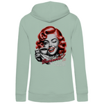 Mintgrüner Damen-Hoodie, Rückansicht, mit einem Vintage-inspirierten Design. Das Motiv zeigt eine Frau mit roten Locken, die eine Kaffeetasse hält und zwinkert. Der Text lautet „None of my Business!“, gefolgt von „Your drama is really entertaining to someone else.“. Der Hoodie kombiniert Retro-Charme mit einem humorvollen Statement auf der Rückseite.