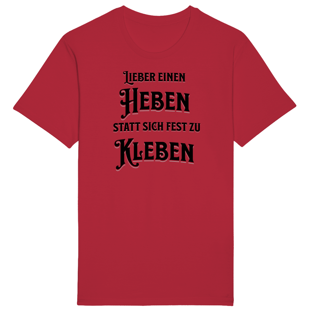 Rotes T-Shirt mit einem witzigen Spruch: „Lieber einen heben statt sich fest zu kleben.“ Der humorvolle Text ist in einer auffälligen, verspielten Schrift gestaltet und spricht diejenigen an, die das Leben mit einem Augenzwinkern und Gelassenheit genießen. Ein Statement-Shirt für entspannte Lebensfreude!