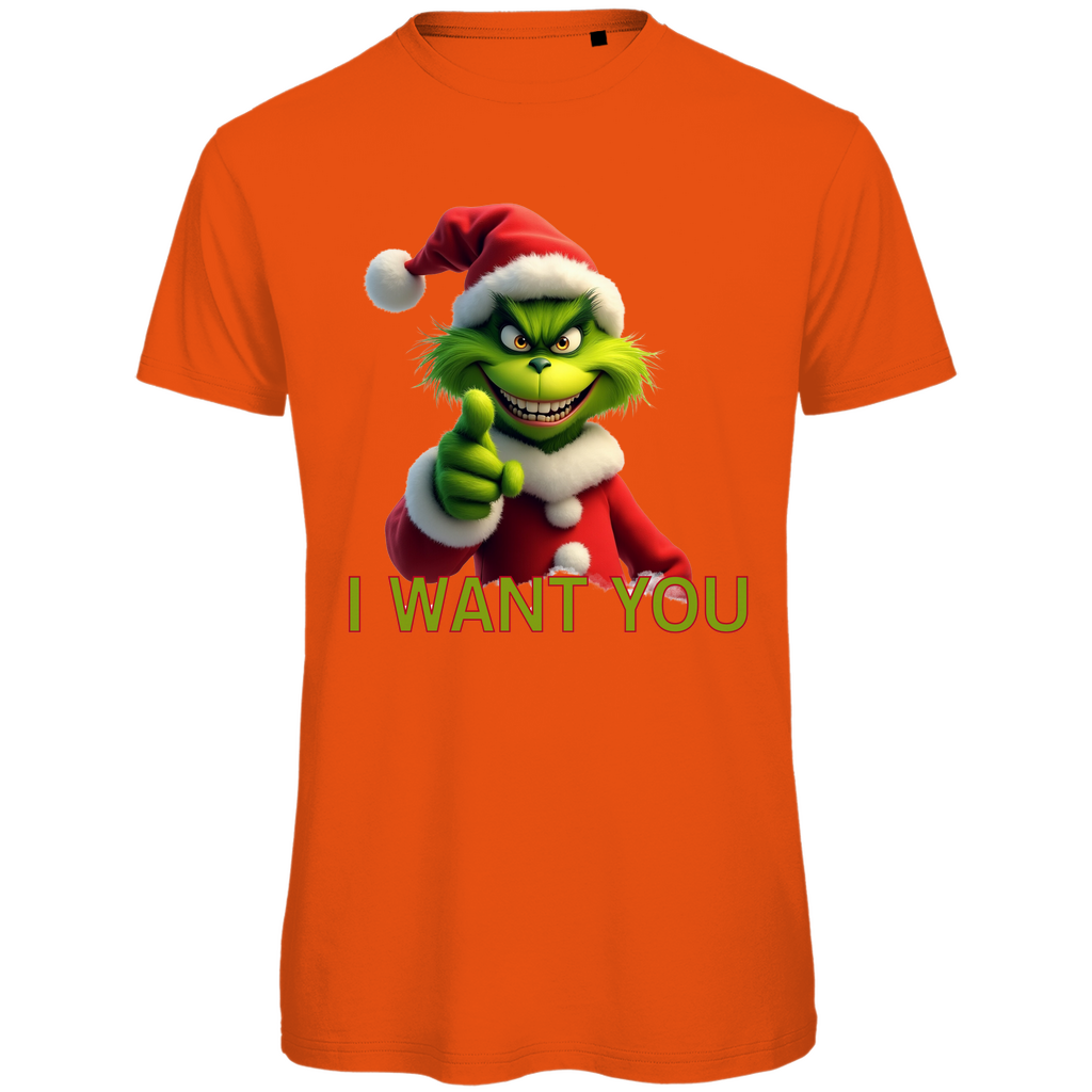 Ein oranges T-Shirt mit einem humorvollen, weihnachtlichen Motiv. Auf der Vorderseite ist eine grüne, grinsende Figur in einem roten Weihnachtsmann-Anzug zu sehen, die direkt in die Kamera zeigt. Darunter steht in gelben Buchstaben mit roter Umrandung der Text "I WANT YOU". Das T-Shirt strahlt eine lustige, festliche Atmosphäre aus und ist perfekt für die Weihnachtszeit geeignet.