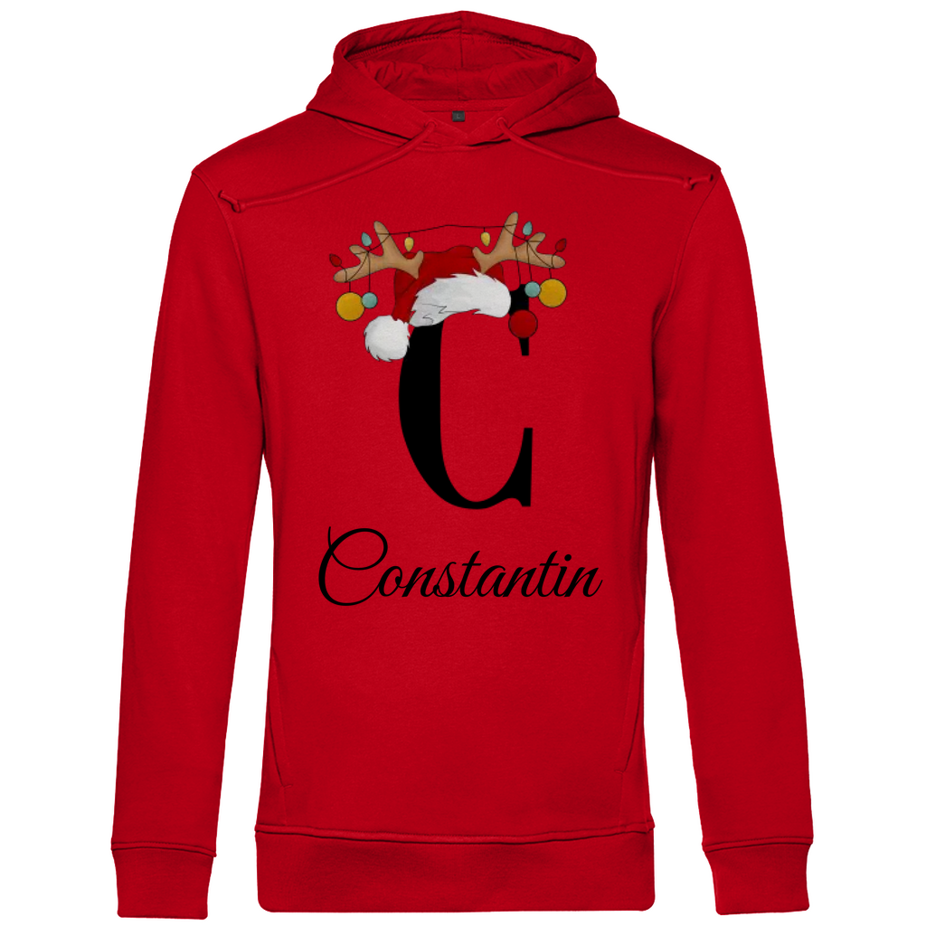 Ein roter Hoodie mit einem weihnachtlichen Design, das den Buchstaben "C" zeigt. Der Buchstabe ist in Schwarz gehalten und mit einem Weihnachtsmann-Hut sowie Rentiergeweihen verziert, an denen bunte Kugeln hängen. Unter dem Buchstaben ist der personalisierte Name "Constantin" in eleganter, geschwungener Schrift zu sehen. Der Hoodie strahlt eine festliche und personalisierte Stimmung aus und eignet sich perfekt für die Winter- und Weihnachtszeit.