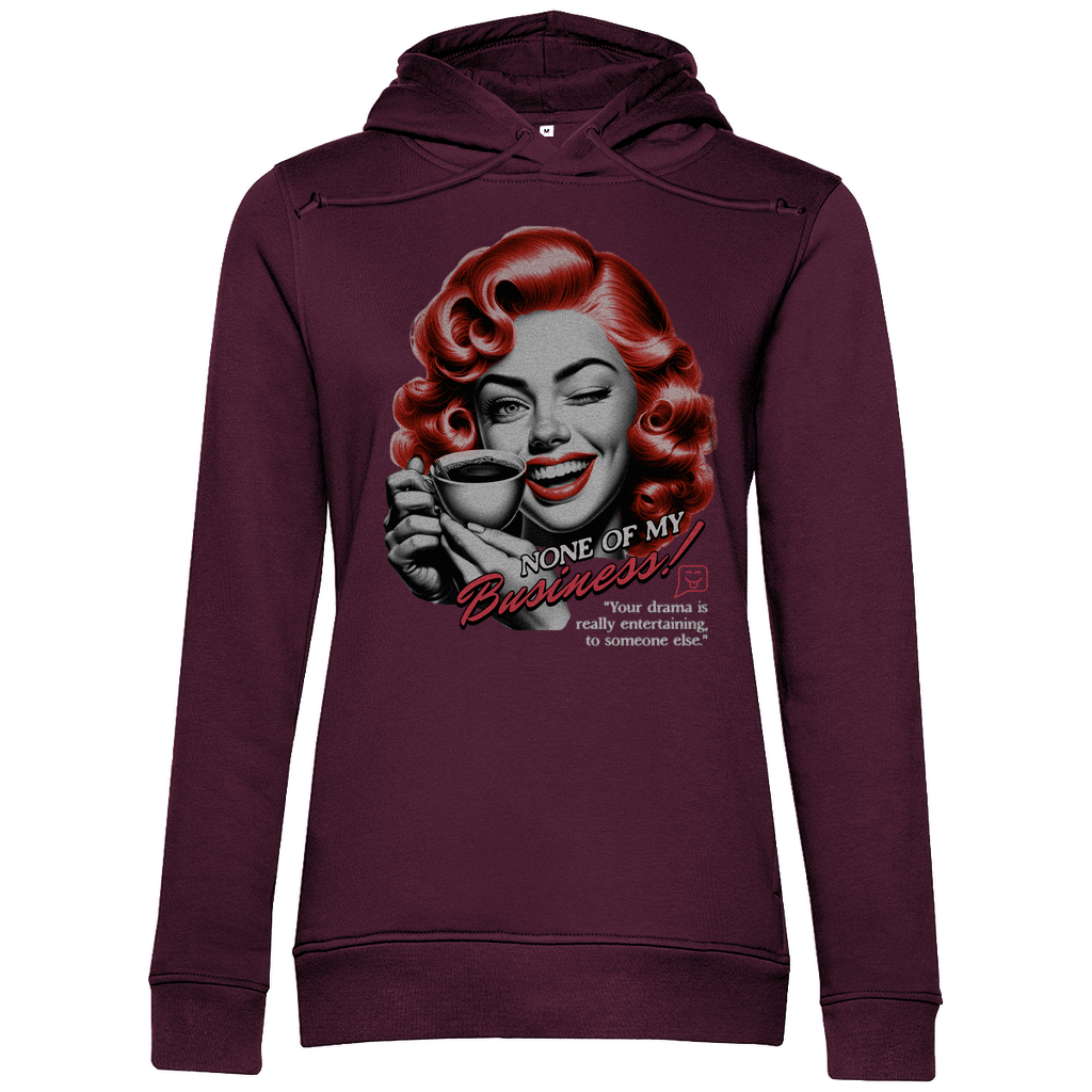 Mintgrüner Damen-Hoodie mit einem Vintage-inspirierten Design. Das Motiv zeigt eine Frau mit roten Locken, die zwinkernd eine Kaffeetasse hält. Der Text auf dem Hoodie lautet „None of my Business!“. Darunter steht: „Your drama is really entertaining to someone else.“. Der Hoodie verbindet Retro-Charme mit einem humorvollen, modernen Statement.