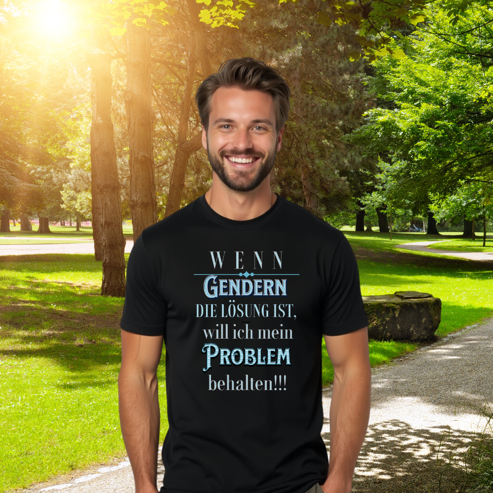 Ein fröhlich lächelnder Mann steht in einem schwarzen T-Shirt mit dem Aufdruck „WENN Gendern DIE LÖSUNG IST, will ich mein PROBLEM behalten!!!“. Er befindet sich in einem sonnigen Park mit grünen Bäumen und Gras im Hintergrund. Das T-Shirt-Design hebt sich gut ab und zeigt eine humorvolle Aussage.