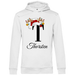 Ein weißer Hoodie mit einem weihnachtlichen Design, das den Buchstaben „T“ in Schwarz zeigt. Der Buchstabe ist mit einem Weihnachtsmann-Hut sowie Rentiergeweihen verziert, an denen bunte Kugeln hängen. Unter dem Buchstaben steht der Name „Thorsten“ in eleganter, geschwungener Schrift. Der Hoodie verleiht eine festliche und persönliche Note, perfekt geeignet für die Weihnachtszeit.