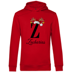 Ein roter Hoodie mit einem weihnachtlichen „Z“-Design in Schwarz, verziert mit einem Weihnachtsmann-Hut und Rentiergeweihen, an denen bunte Kugeln hängen. Unter dem Buchstaben steht der Name „Zacharias“ in eleganter, geschwungener Schrift. Der Hoodie strahlt eine festliche und personalisierte Stimmung aus, perfekt für die Weihnachtszeit.