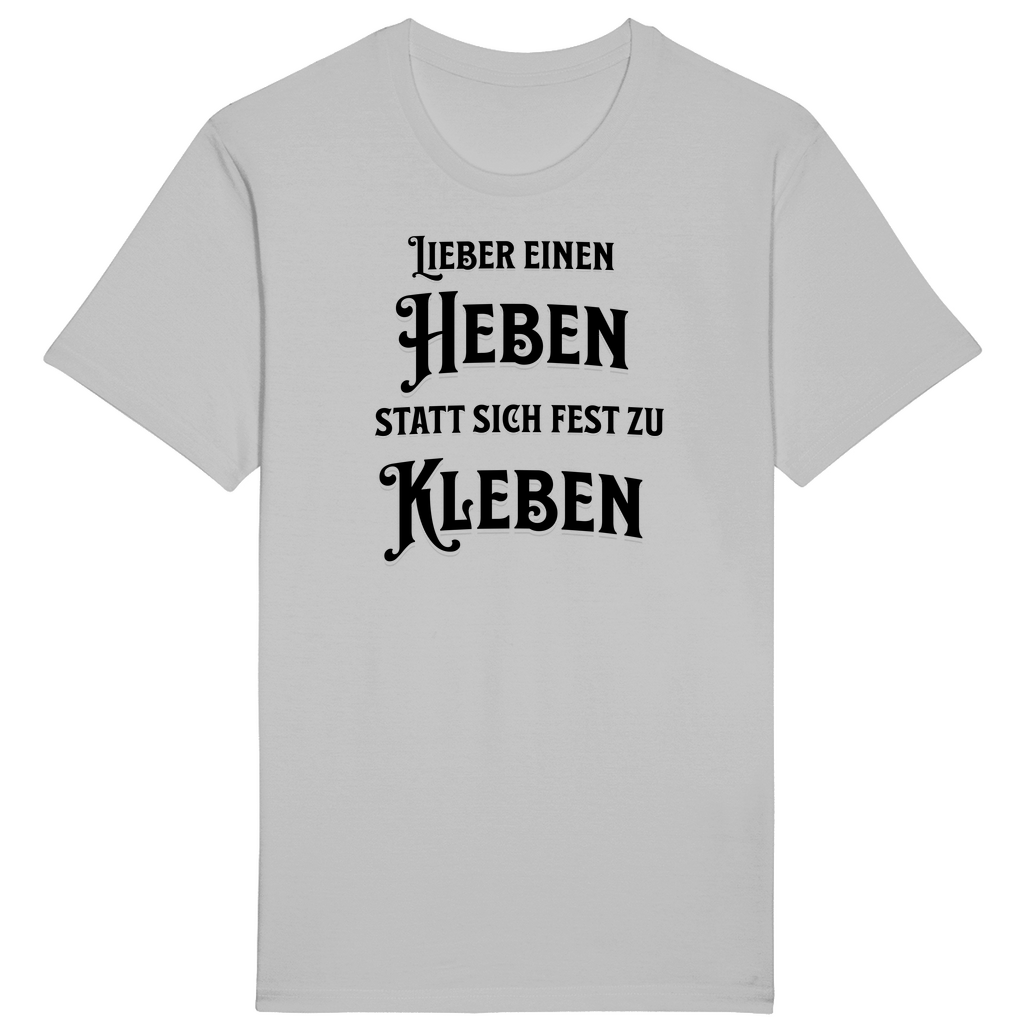 Hellgraues T-Shirt mit einem witzigen Spruch: „Lieber einen heben statt sich fest zu kleben.“ Der humorvolle Text ist in einer auffälligen, verspielten Schrift gestaltet und spricht diejenigen an, die das Leben mit einem Augenzwinkern und Gelassenheit genießen. Ein Statement-Shirt für entspannte Lebensfreude!